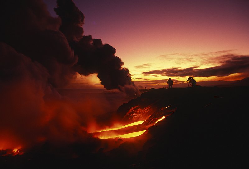 GBL-VLO-6.jpg :: Man at the top of a cliff in Hawaii Volcanoes National Park films lava flows